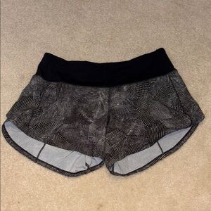 Lululemon Black and Gray Athletic Shorts with Curved Hem